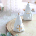 Figurine Père Noël tenant un Cadeau – Räder