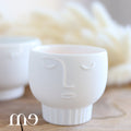 Mini cache pot visage Räder